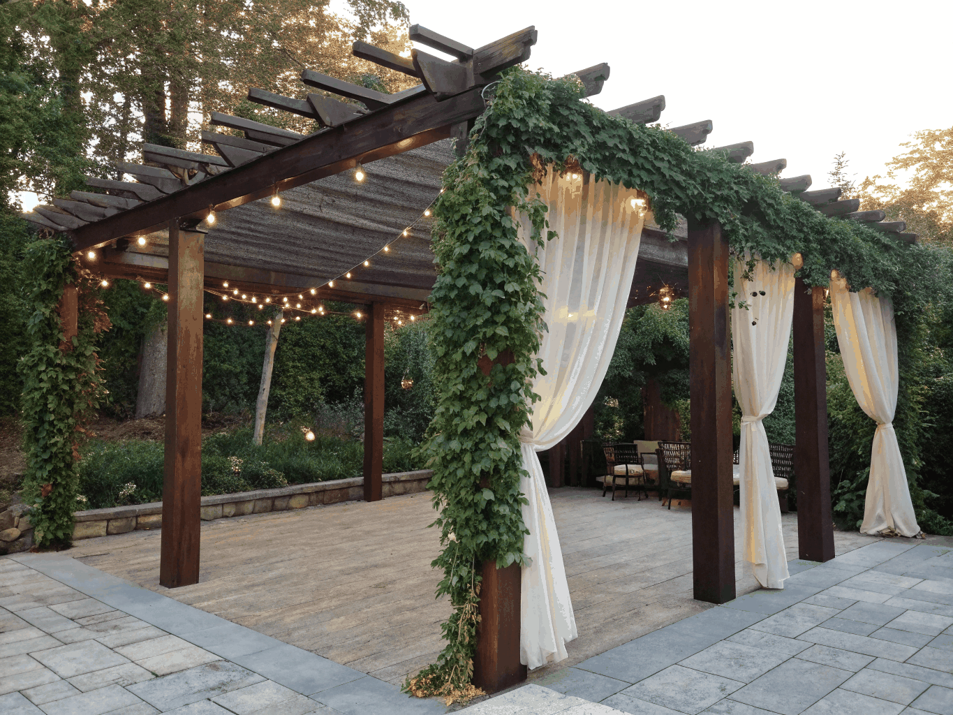 Custom cedar pergola and shrub borders